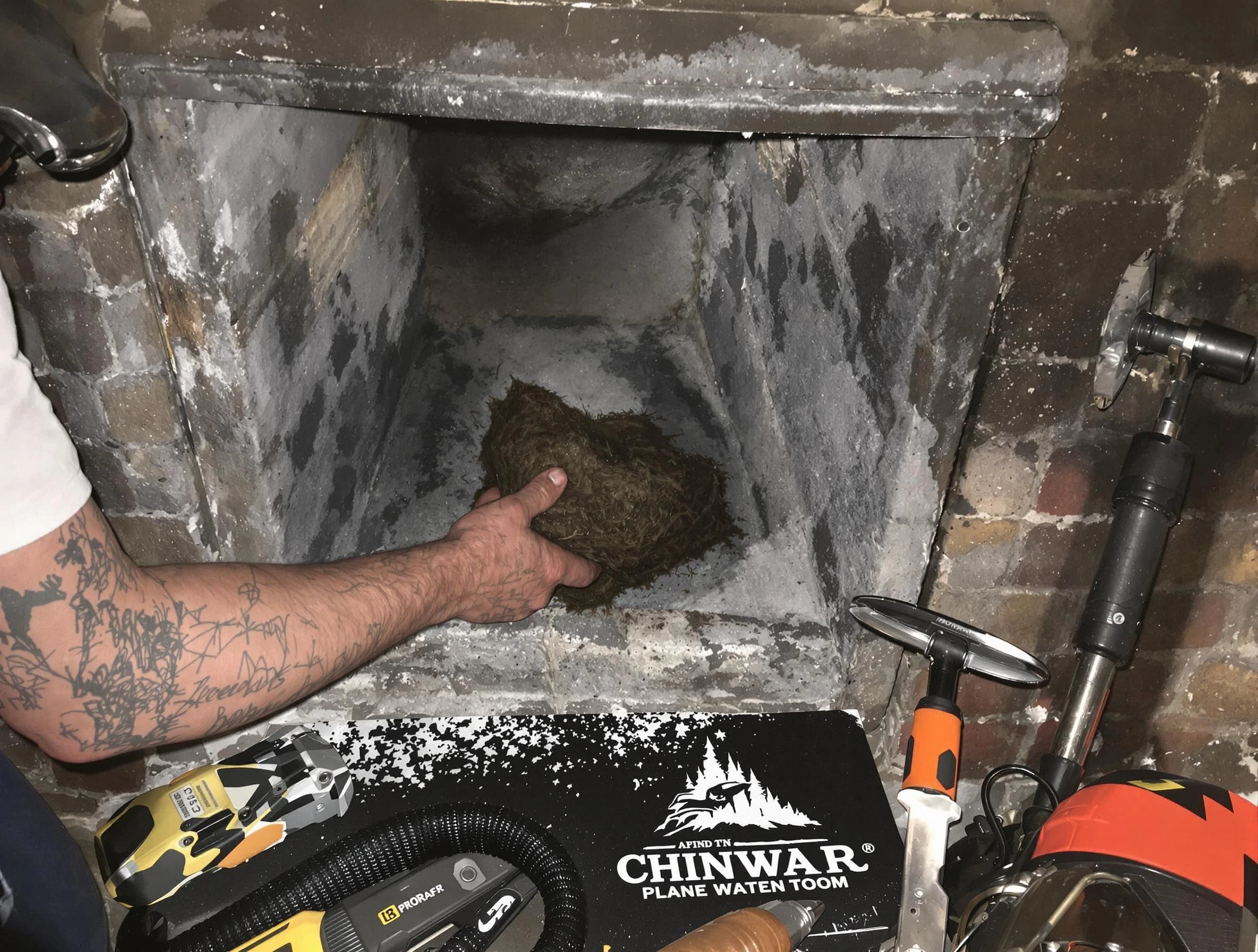 Quincy Chimney Sweep safely removing debris and screening chimney in Quincy, MA
