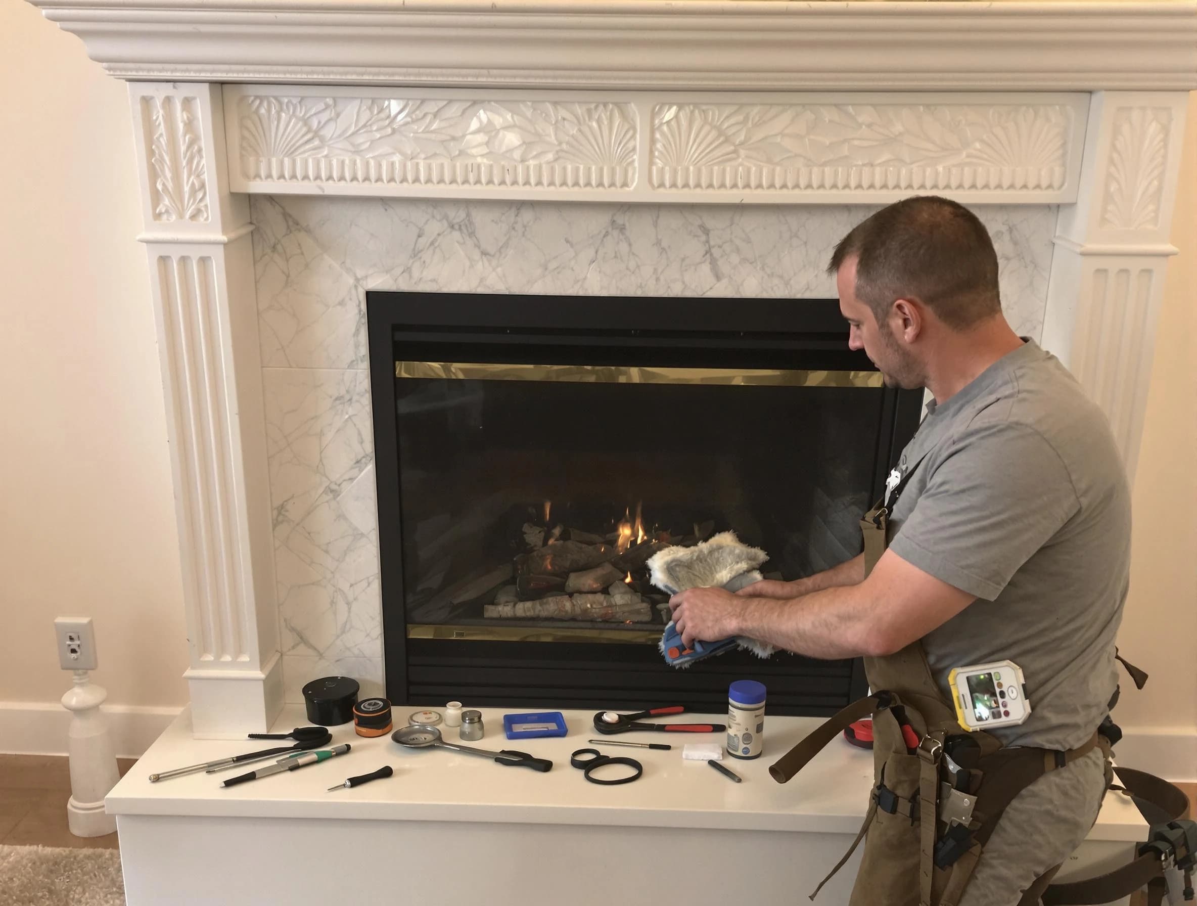 Quincy Chimney Sweep performing fireplace maintenance in Quincy, MA